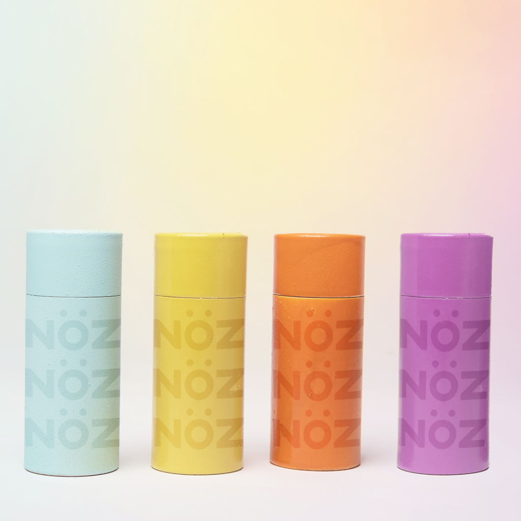 Noz's sunscreen offered in 4 neon colors blue, yellow, orange, and purple.
